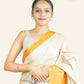 BEIGE TUSSAR SILK SAREE WITH MUSTARD CHECKED BORDER AND BIRD DESIGNS