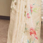 CREAMY YELLOW LINEN SAREE WITH ALL OVER SEQUINS WEAVING AND MULTICOLORED FLORAL PAINTED DESIGNS